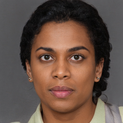 Neutral black young-adult female with short  black hair and brown eyes