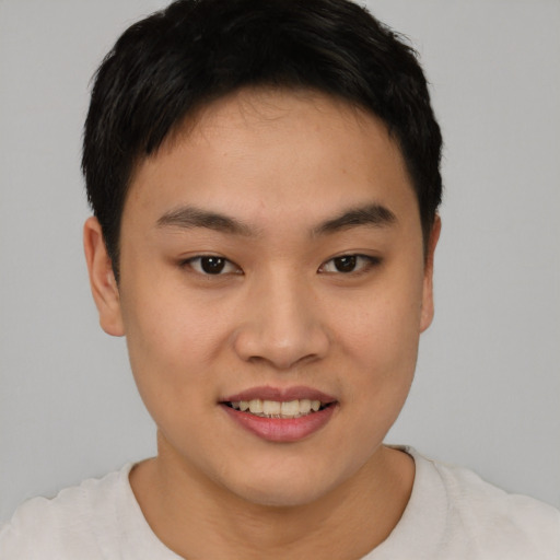 Joyful asian young-adult female with short  brown hair and brown eyes