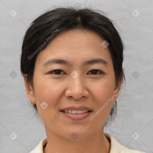 Joyful asian young-adult female with short  brown hair and brown eyes