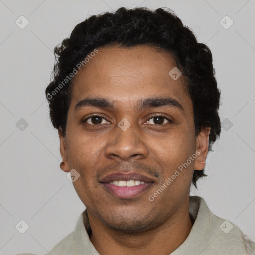 Joyful black young-adult male with short  black hair and brown eyes