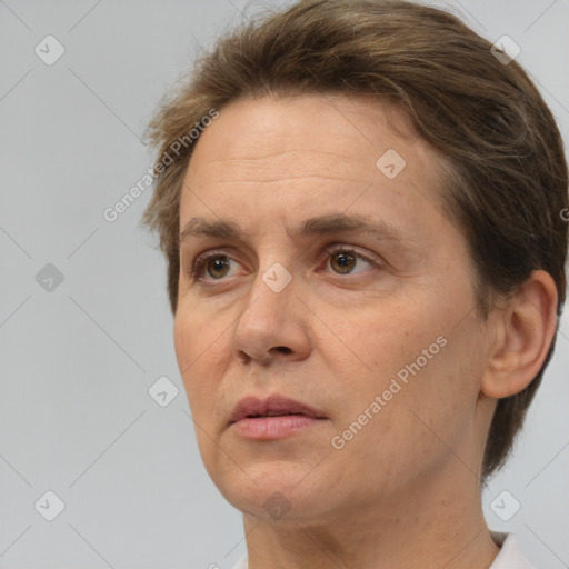 Joyful white adult female with short  brown hair and brown eyes