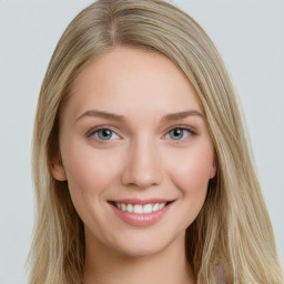 Joyful white young-adult female with long  brown hair and blue eyes