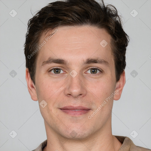 Joyful white adult male with short  brown hair and grey eyes