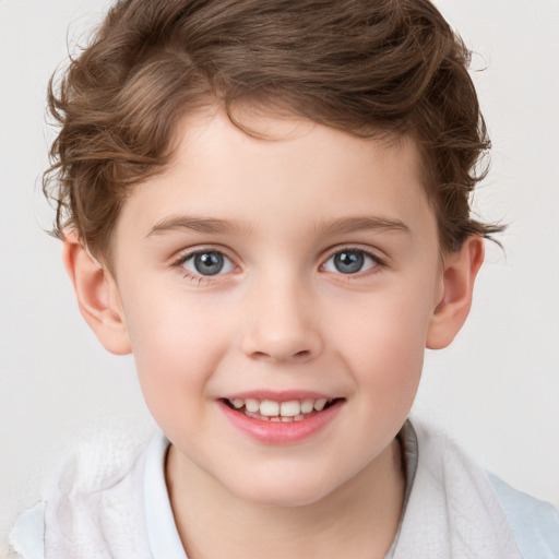 Joyful white child male with short  brown hair and grey eyes