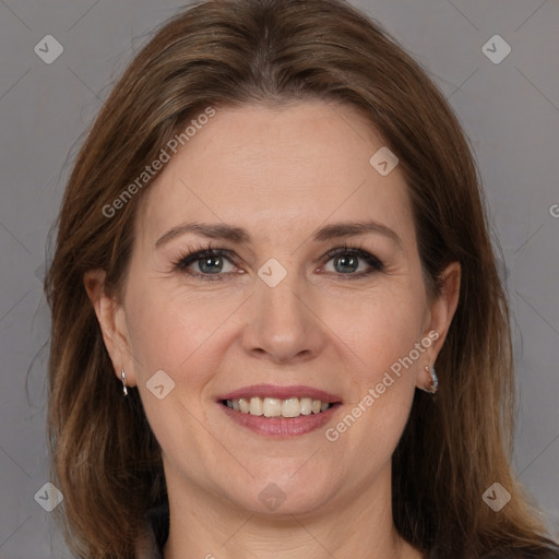 Joyful white adult female with medium  brown hair and brown eyes