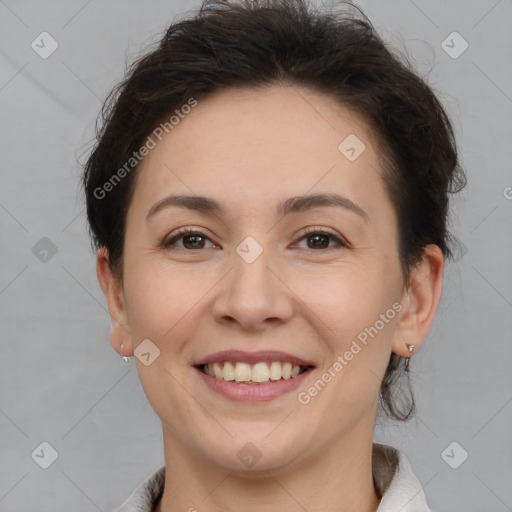 Joyful white adult female with short  brown hair and brown eyes