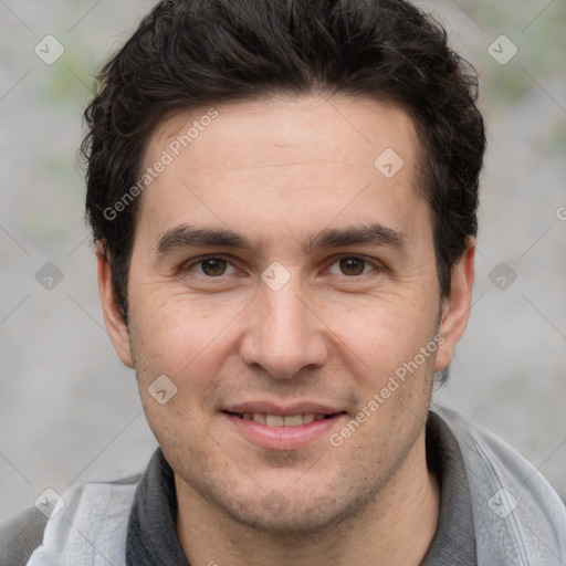 Joyful white adult male with short  brown hair and grey eyes