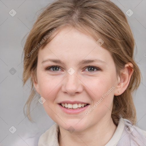 Joyful white young-adult female with medium  brown hair and blue eyes