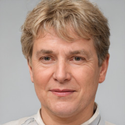 Joyful white middle-aged male with short  brown hair and brown eyes