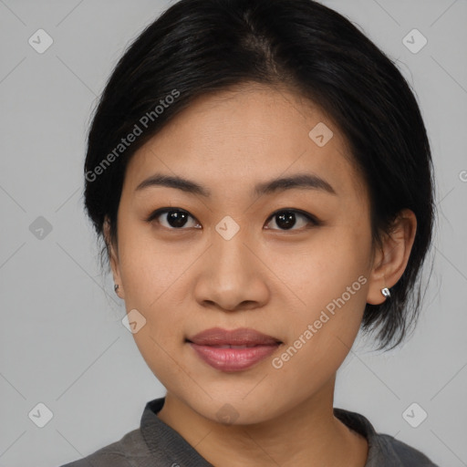 Joyful asian young-adult female with medium  black hair and brown eyes