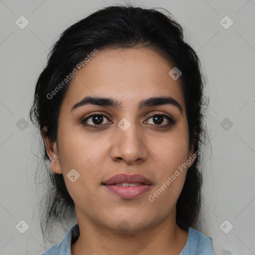 Joyful latino young-adult female with medium  brown hair and brown eyes