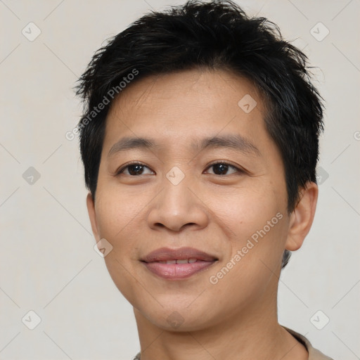 Joyful asian young-adult male with short  brown hair and brown eyes