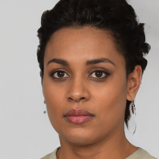 Neutral latino young-adult female with short  black hair and brown eyes