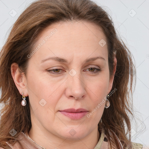 Joyful white adult female with long  brown hair and grey eyes