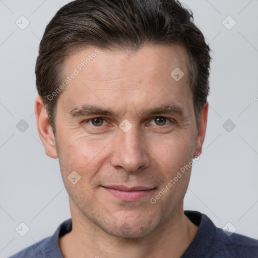 Joyful white adult male with short  brown hair and grey eyes