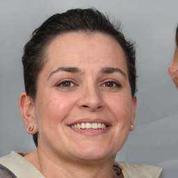 Joyful white adult female with short  brown hair and brown eyes