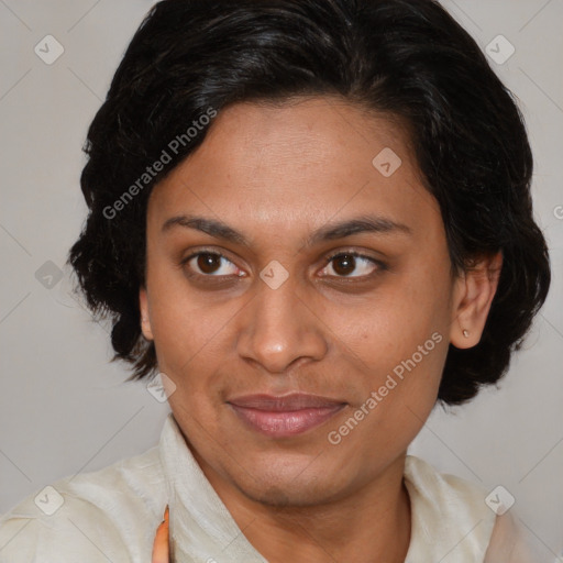 Joyful latino adult female with medium  brown hair and brown eyes