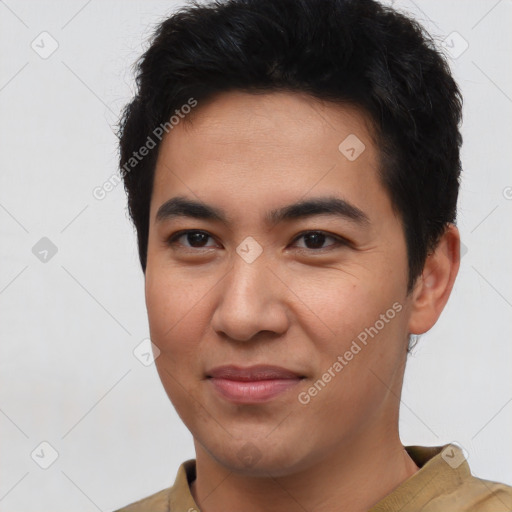 Joyful latino young-adult male with short  brown hair and brown eyes