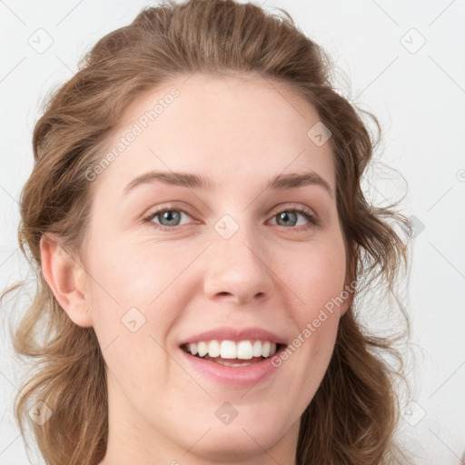 Joyful white young-adult female with medium  brown hair and blue eyes