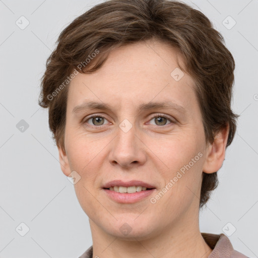 Joyful white adult female with short  brown hair and grey eyes