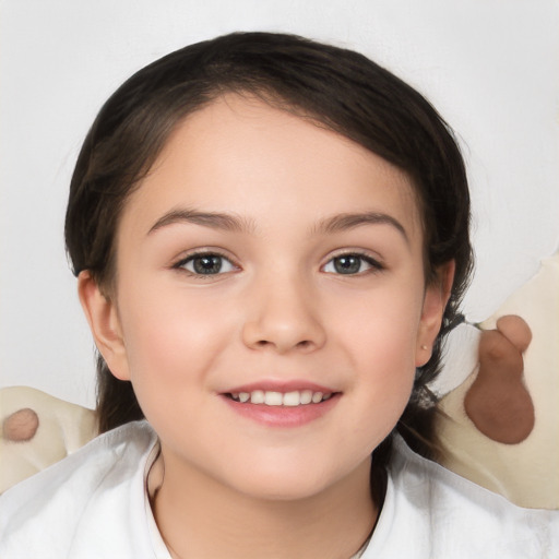 Joyful white child female with medium  brown hair and brown eyes