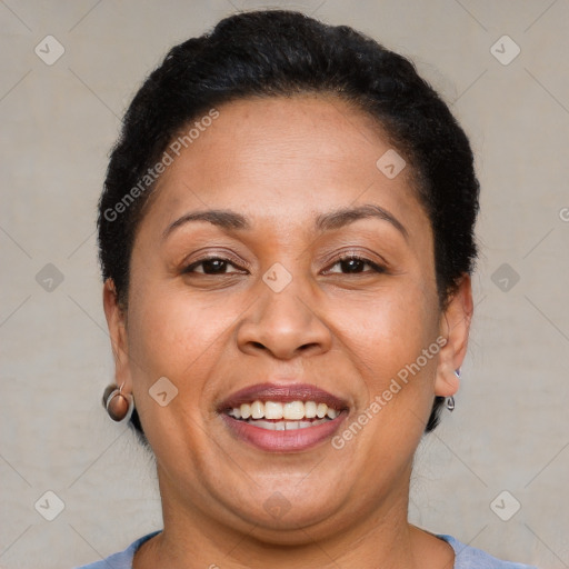 Joyful latino adult female with short  brown hair and brown eyes