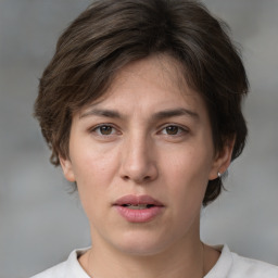 Neutral white young-adult female with medium  brown hair and brown eyes