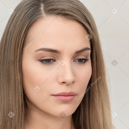 Neutral white young-adult female with long  brown hair and brown eyes