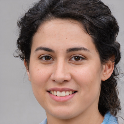 Joyful white young-adult female with medium  brown hair and brown eyes