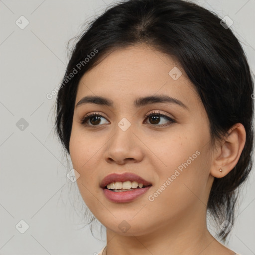 Joyful asian young-adult female with medium  brown hair and brown eyes