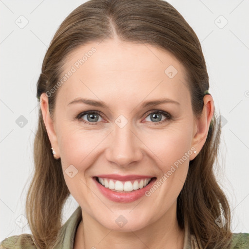 Joyful white young-adult female with long  brown hair and grey eyes