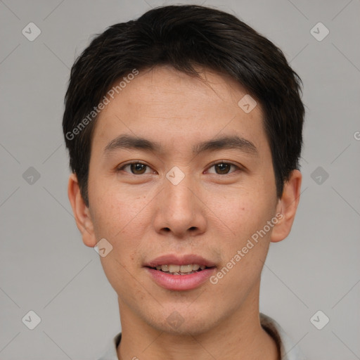 Joyful asian young-adult male with short  brown hair and brown eyes