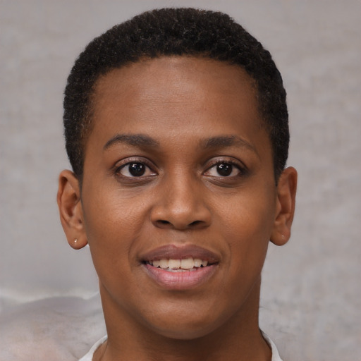 Joyful black young-adult female with short  brown hair and brown eyes
