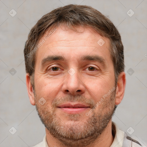 Joyful white adult male with short  brown hair and brown eyes