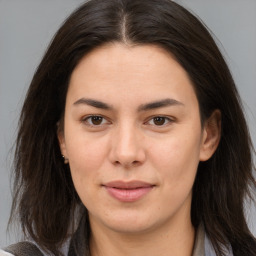 Joyful white young-adult female with medium  brown hair and brown eyes