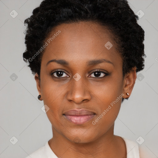 Joyful black young-adult female with short  black hair and brown eyes