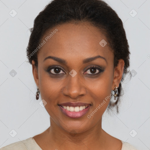 Joyful black young-adult female with short  black hair and brown eyes