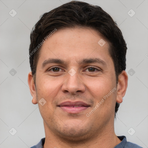 Joyful white adult male with short  brown hair and brown eyes