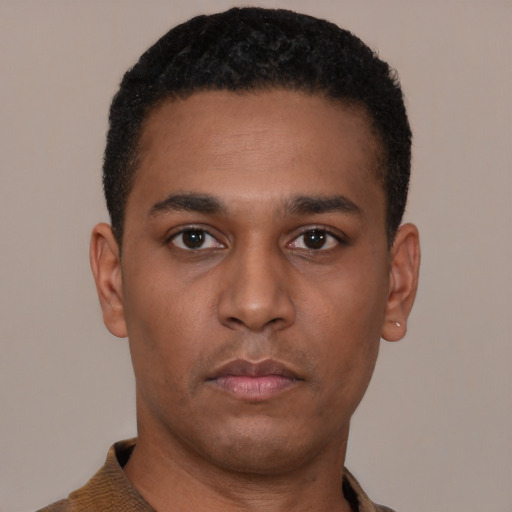 Neutral latino young-adult male with short  black hair and brown eyes