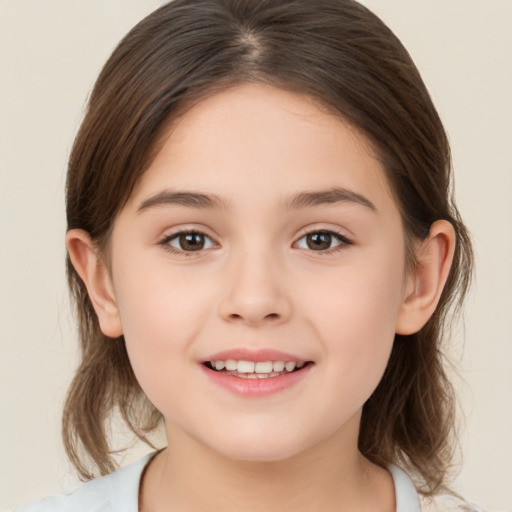 Joyful white child female with medium  brown hair and brown eyes