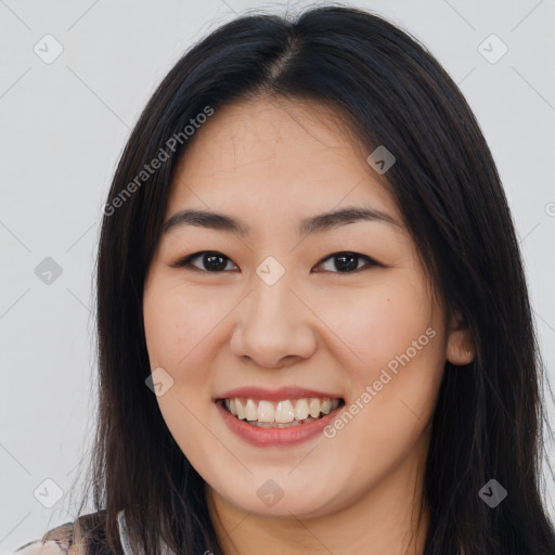 Joyful asian young-adult female with long  brown hair and brown eyes