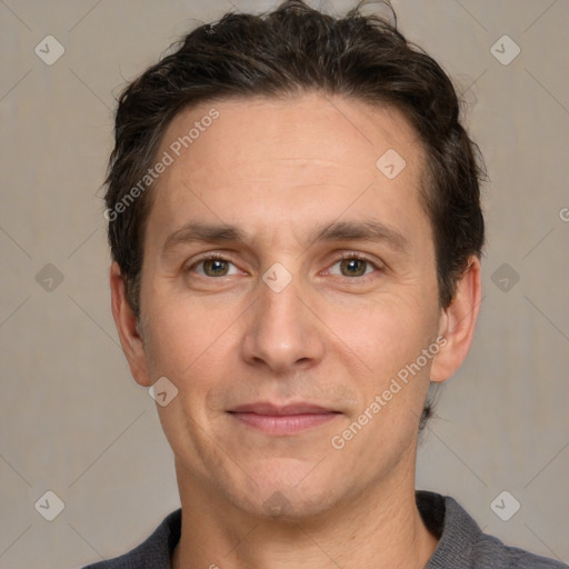 Joyful white adult male with short  brown hair and grey eyes