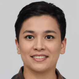 Joyful asian young-adult female with short  black hair and brown eyes