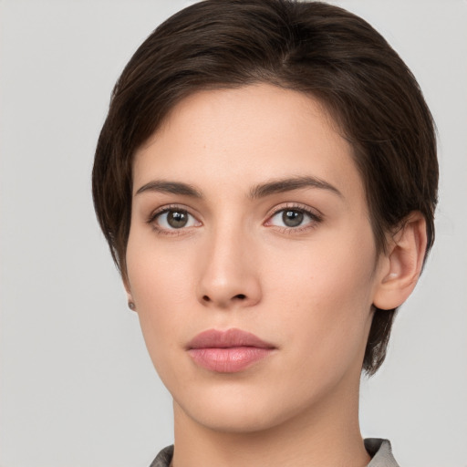 Neutral white young-adult female with short  brown hair and brown eyes