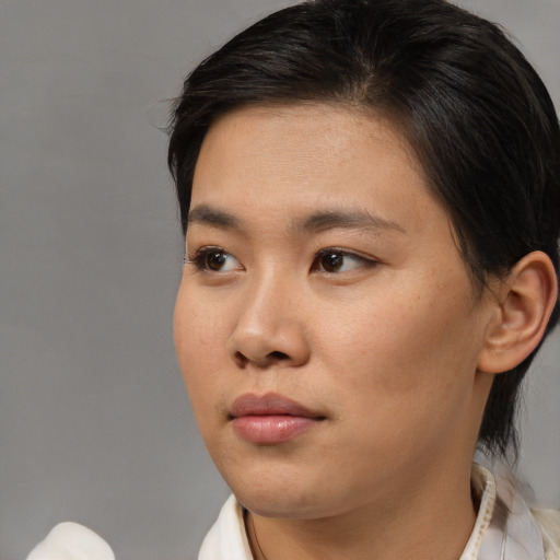 Neutral asian young-adult female with medium  brown hair and brown eyes