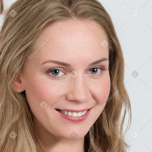 Joyful white young-adult female with long  brown hair and blue eyes