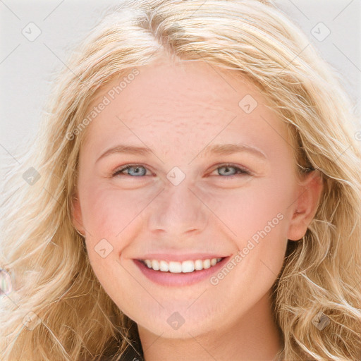 Joyful white young-adult female with long  brown hair and blue eyes