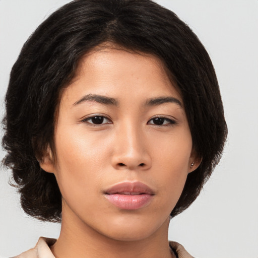 Neutral asian young-adult female with medium  brown hair and brown eyes