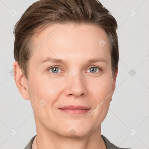 Joyful white adult female with short  brown hair and grey eyes