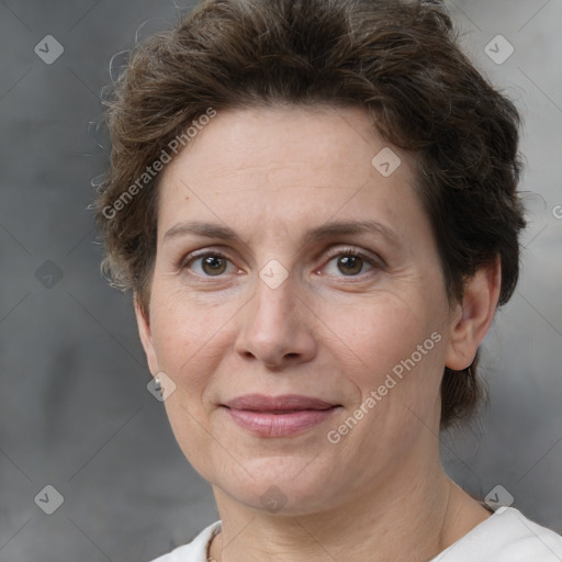 Joyful white adult female with short  brown hair and brown eyes